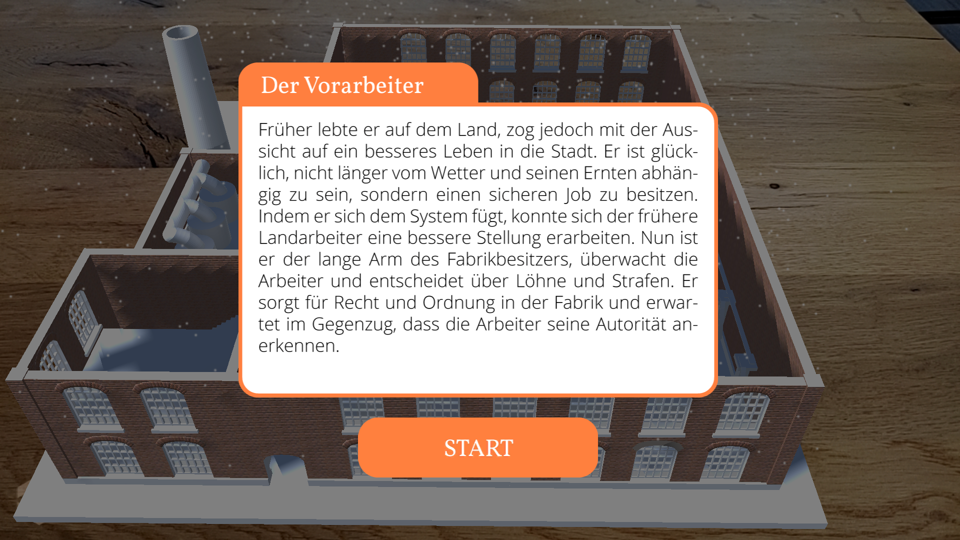 Screenshot of yARn that shows a 3D rendered factory projected on a wooden table from the perspective of the foreman. In the foreground a short description of the role of the foreman and a 'start' button are displayed.